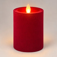 Burgundy 10 cm LED pillar candle glowing with a dancing flame