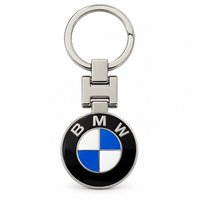 Metal car logo keychain with a round blue and white logo