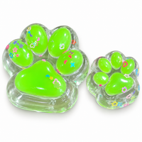 Two green jelly cat paw squishies, big and mini