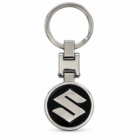 Metal car logo keychain with a round black logo and a silver S