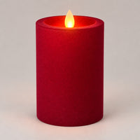 Burgundy 12.5 cm LED pillar candle glowing with a dancing flame