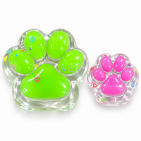 Green jelly cat paw squishy with a pink mini paw