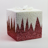 Red glitter gift box decoration with a white beaded snow top and bow