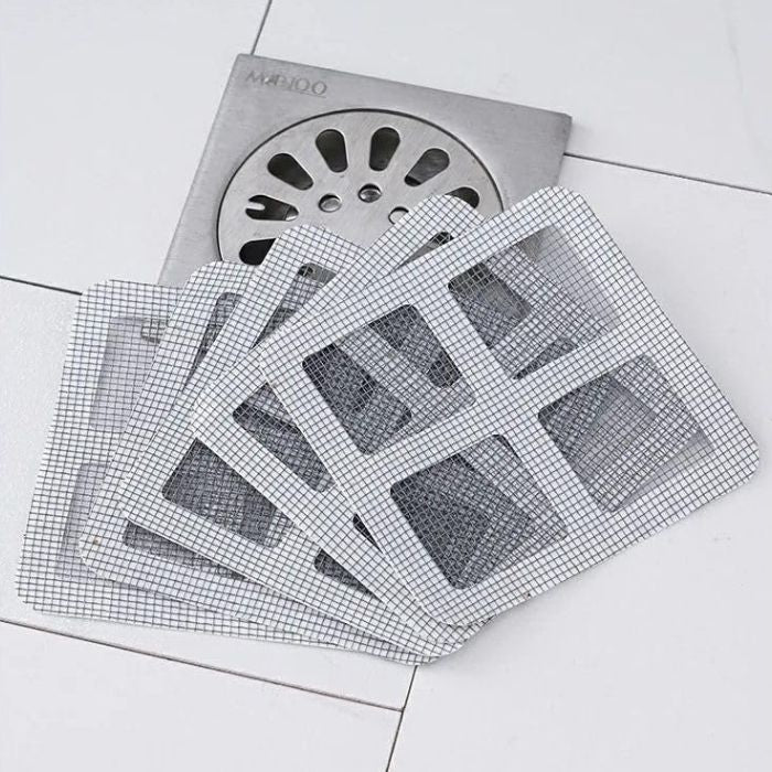 3 disposable mesh sink strainer stickers over a shower drain
