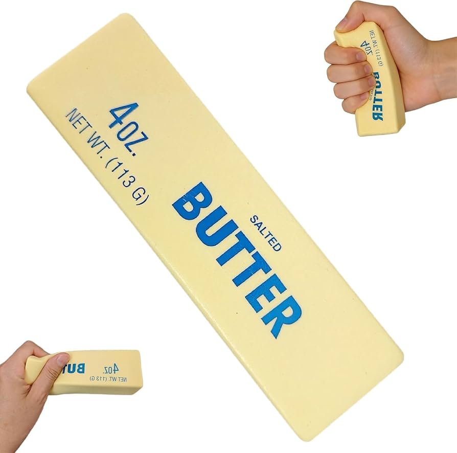 Butter stick squishy next to a hand to show its size