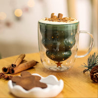 Christmas tree double-wall glass mug with hot chocolate and whipped cream