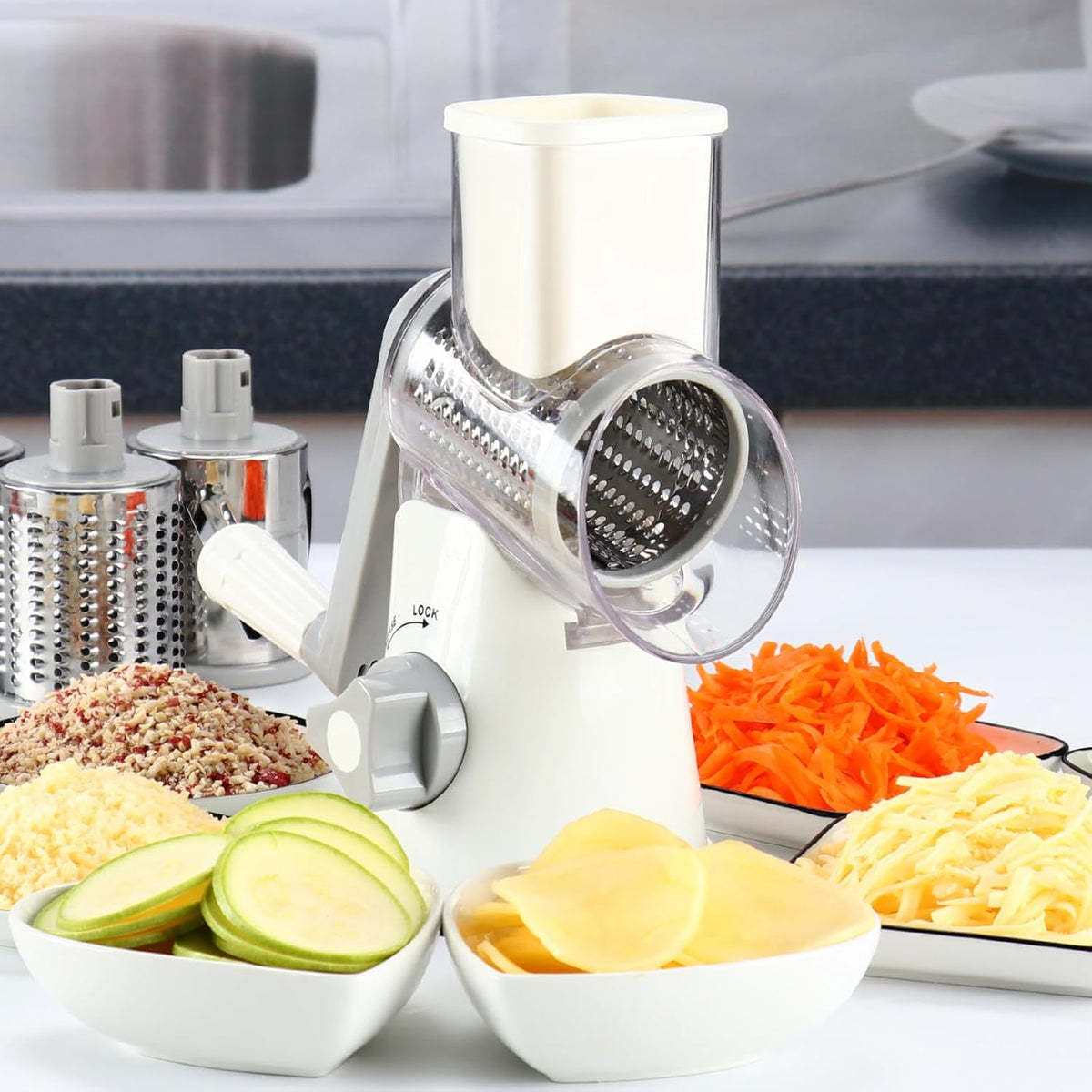 Rotary vegetables grater and slicer with grated cheese, carrots and sliced zucchini