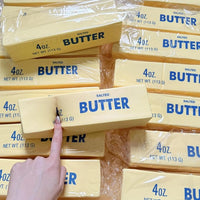 Finger pressing a butter stick squishy