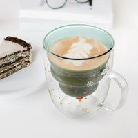 Christmas tree double-wall glass mug filled with a latte