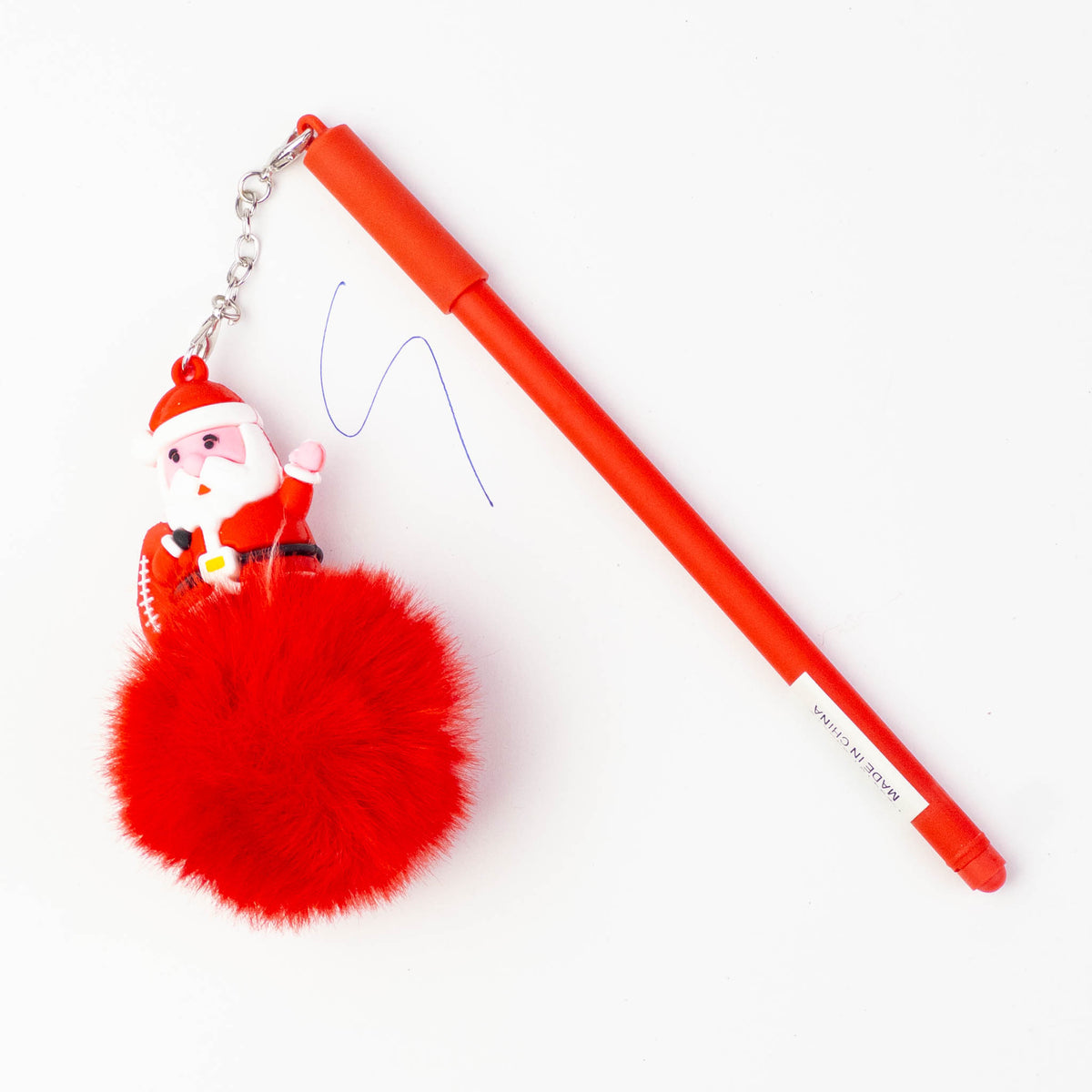 Red Christmas pen with a red fluffy pom pom and a Santa charm