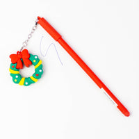 Red Christmas pen with a wreath keychain charm