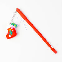 Red Christmas pen with a stocking keychain charm