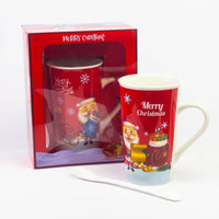 Tall red Christmas mug with spoon next to its Merry Christmas gift box
