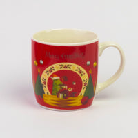 Red ceramic Merry Christmas mug with a festive holiday scene