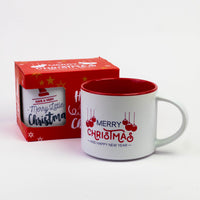 Christmas quote mug with red inside next to its red gift box
