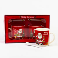 Red Santa mug with spoon next to the 2pcs Santa mug set gift box