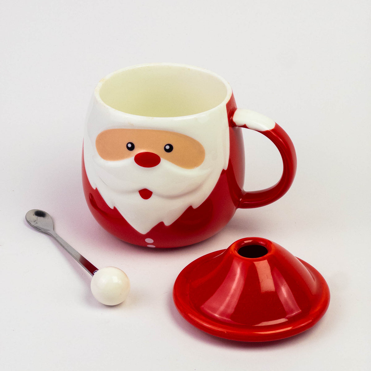 Santa face mug with its hat lid and spoon with a white pom-pom tip