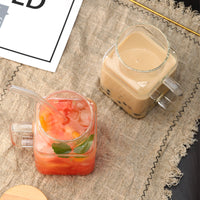Glass jar with bamboo lid and glass straw