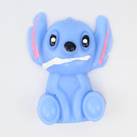 Blue big-eared alien taba squishy with a toothy grin