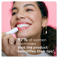 Woman applying LABELLO Strawberry Shine lip balm