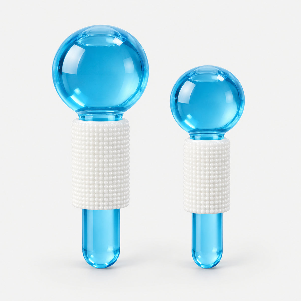 2 blue facial massage crystal balls, large and small, with white grips
