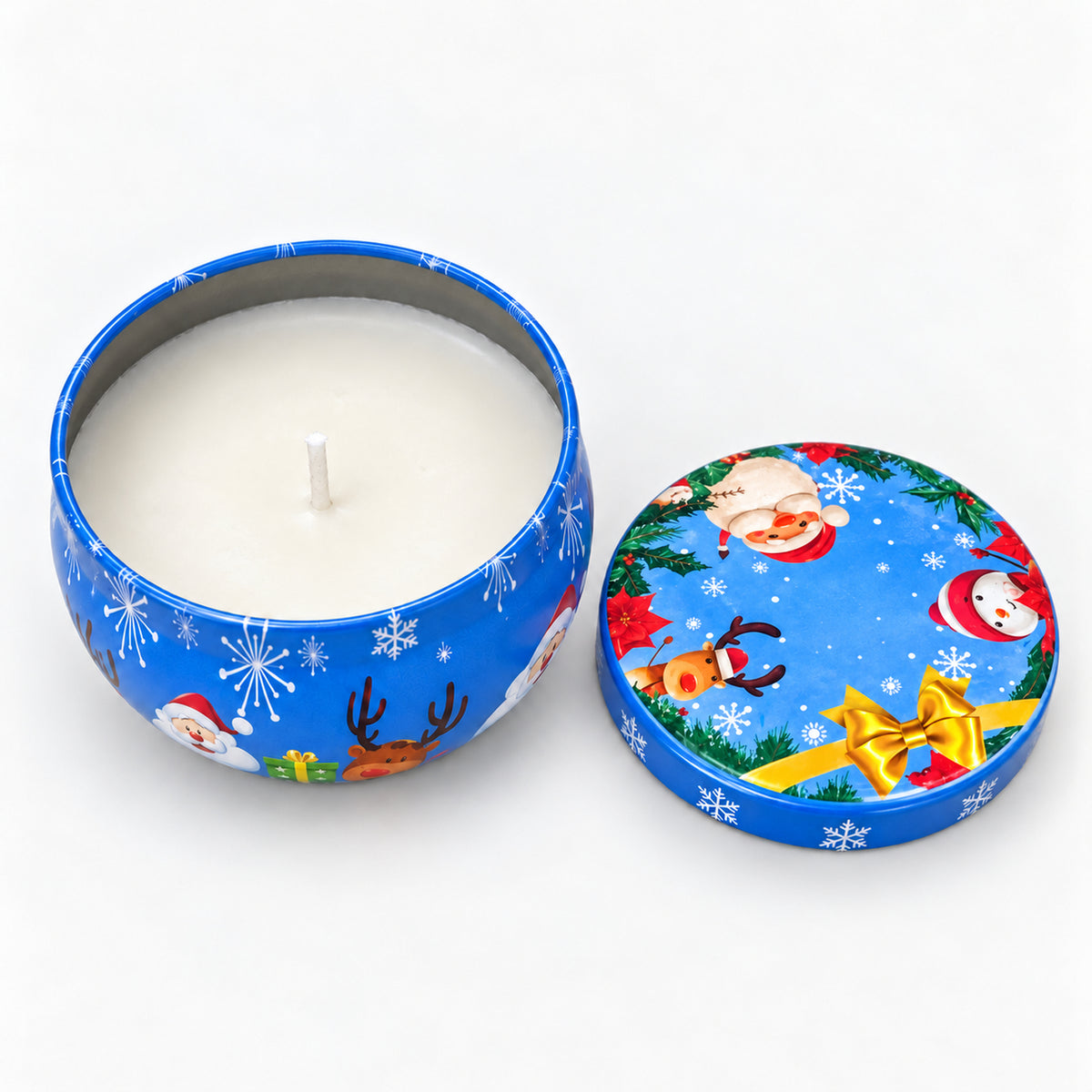 Blue Christmas candle tin with Christmas characters and a gold bow, open with a white candle inside