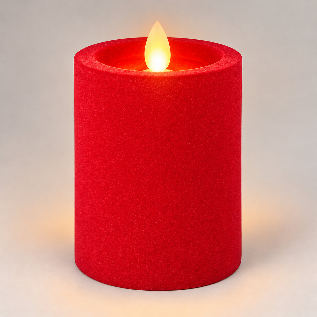 Red 10 cm LED pillar candle glowing with a dancing flame