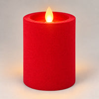 Red 10 cm LED pillar candle glowing with a dancing flame