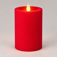 Red 12.5 cm LED pillar candle glowing with a dancing flame