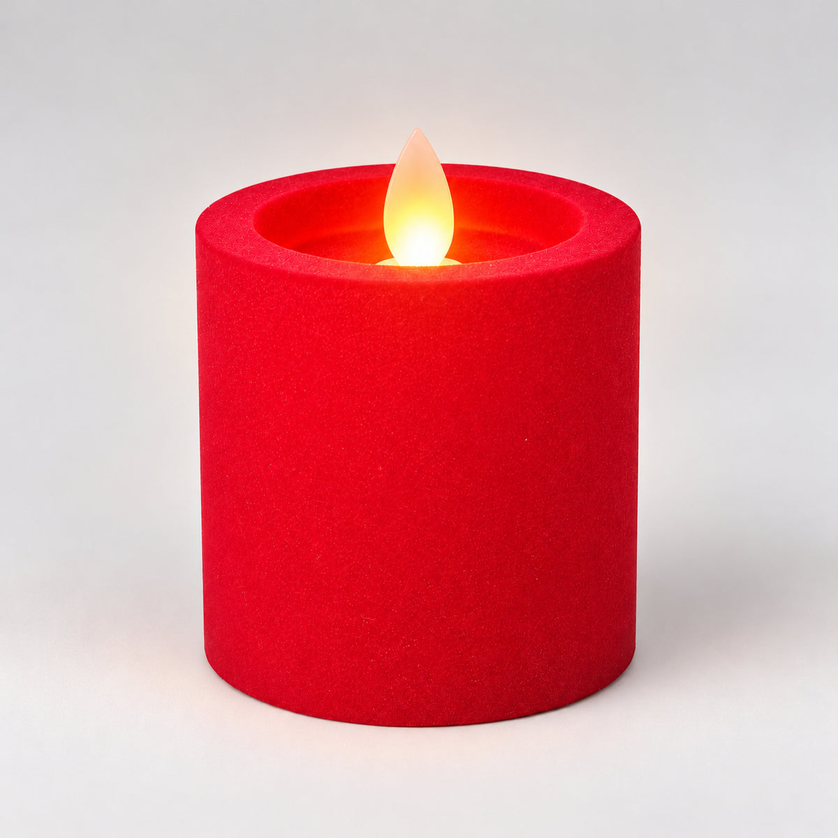 Red 7.5 cm LED pillar candle glowing with a dancing flame