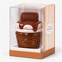 Chocolate cookie cupcake perfume in its striped gift box with a clear window