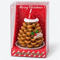 Gold pinecone Christmas candle in a clear Merry Christmas gift box