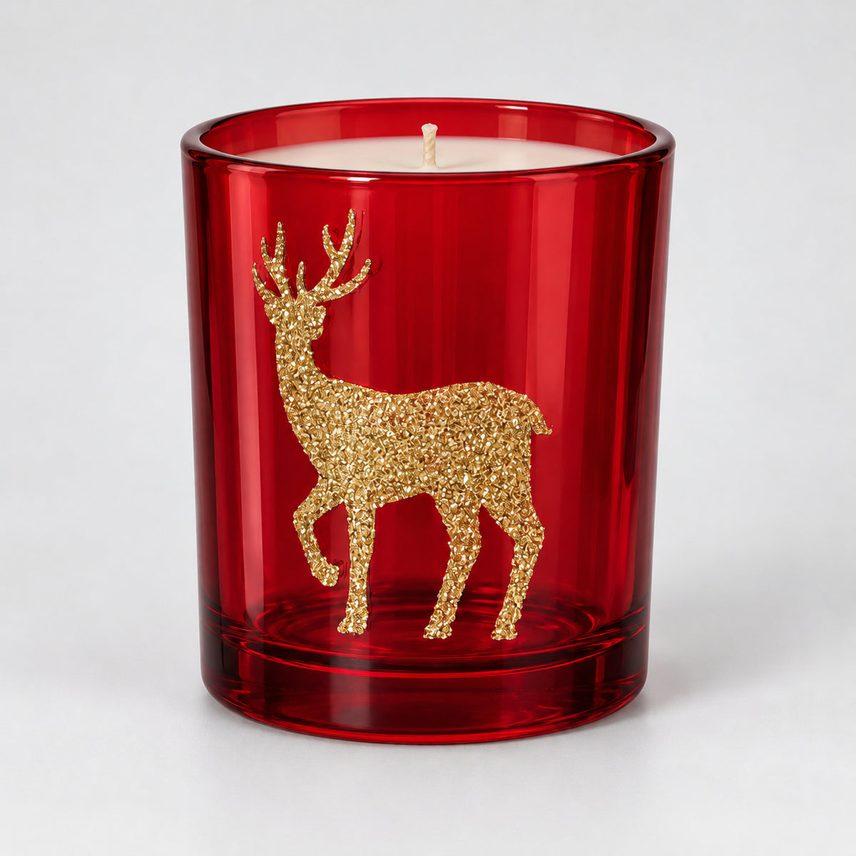 Red glass Christmas candle with a gold glitter reindeer
