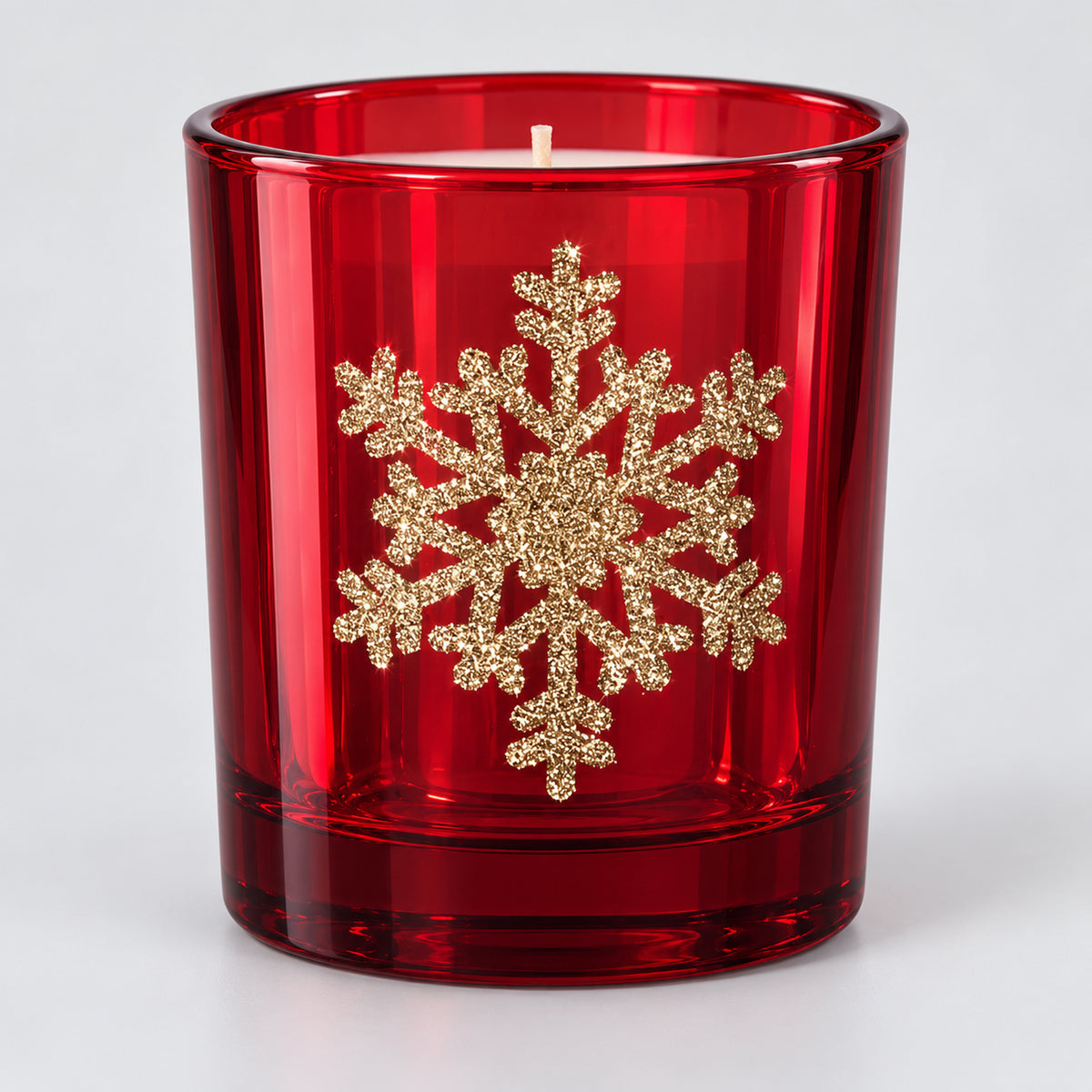 Red glass Christmas candle with a gold glitter snowflake