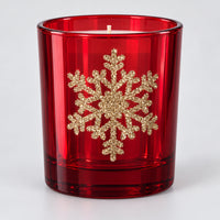 Red glass Christmas candle with a gold glitter snowflake