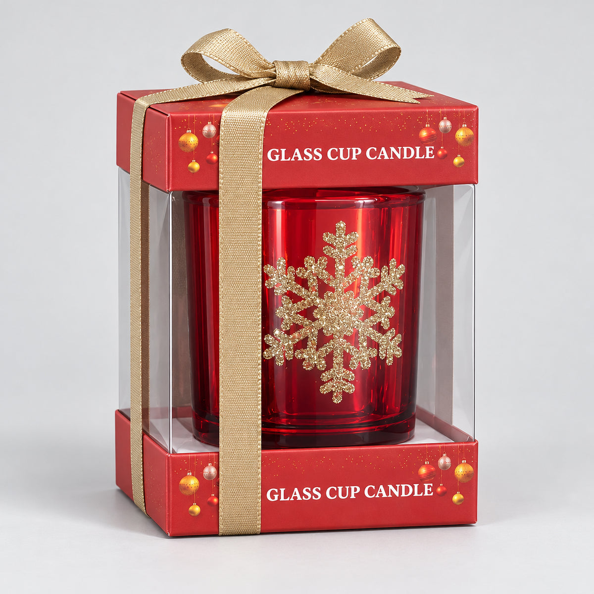 Red glass snowflake candle in a Glass Cup Candle gift box with a gold ribbon