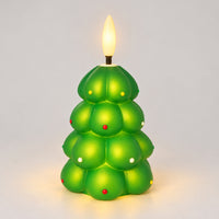 Green Christmas tree LED candle glowing with a warm LED flame