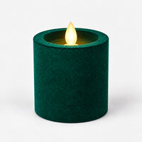 Green 7.5 cm LED pillar candle glowing with a dancing flame