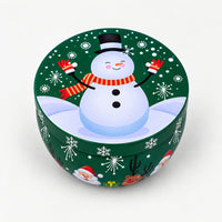 Green Christmas candle tin with a snowman