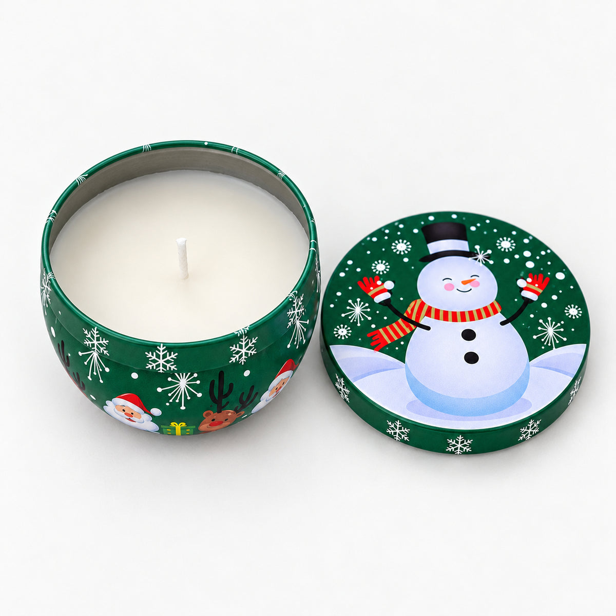 Green Christmas candle tin with a snowman, open with a white candle inside
