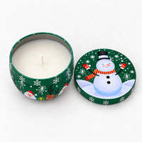 Green Christmas candle tin with a snowman, open with a white candle inside