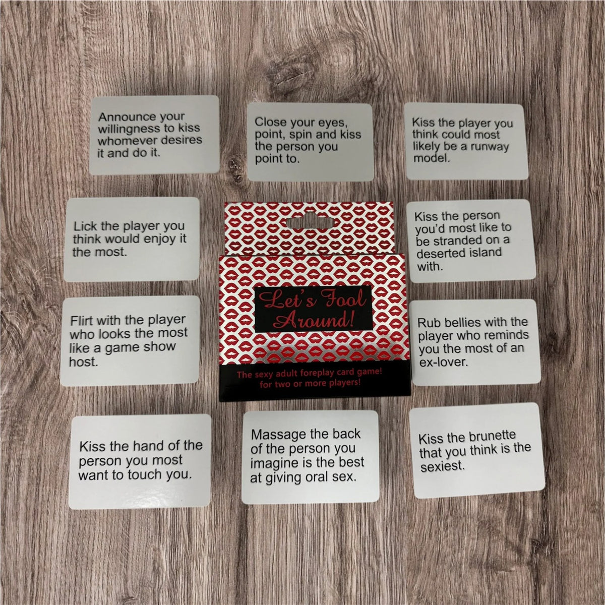 Let's Fool Around! action cards spread around the box