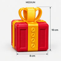 Medium red & gold prank gift box with screws and a bow, 8 x 10 cm