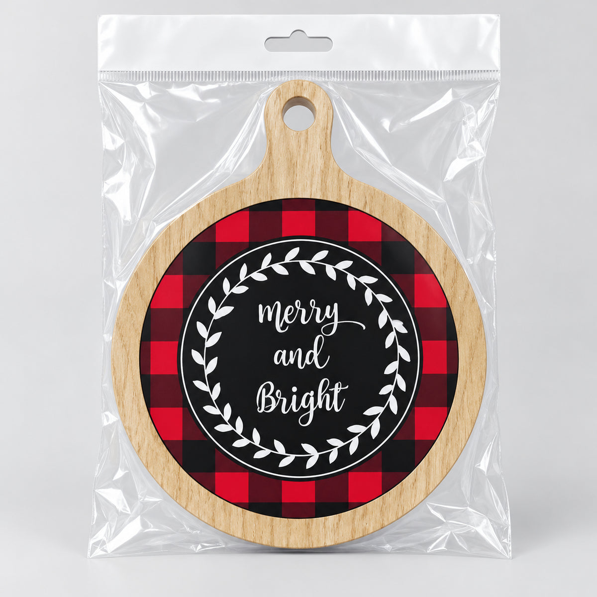 Merry and Bright coaster in a clear bag