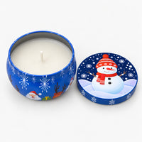 Navy Christmas candle tin with a snowman, open with a white candle inside