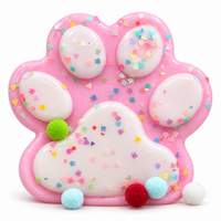 Big pink cat paw squishy with sprinkles and pompoms