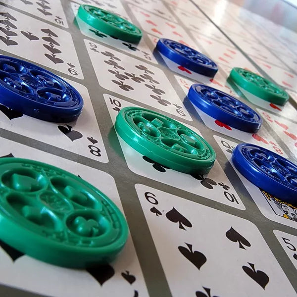 Close-up of SEQUENCE chips on the card game board