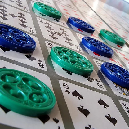 Close-up of SEQUENCE chips on the card game board