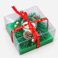 Pine wreath tealight candle holder in a gift box with a red ribbon