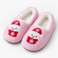 Pink fuzzy Christmas slippers with a snowman patch